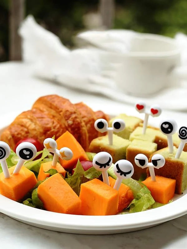 Garfo de fruta aleatório desenho de olhos